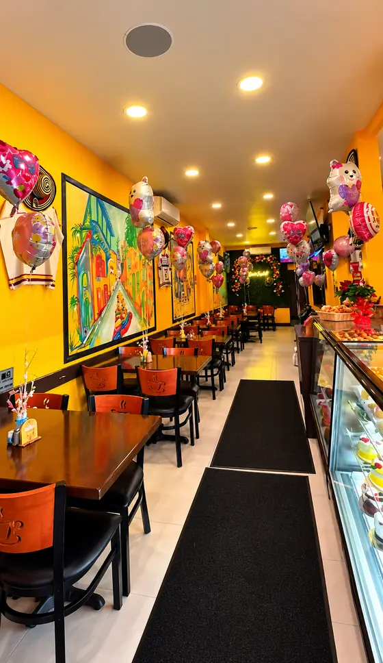 Dining room and bakery case at El Rinconcito Paisa 2, Hollis Queens NY